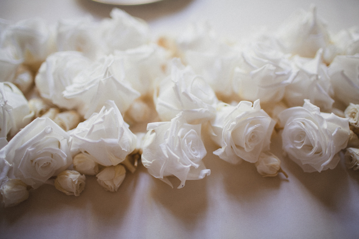 white roses at a wedding reception