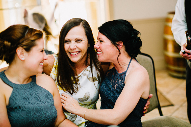 family laughing at reception
