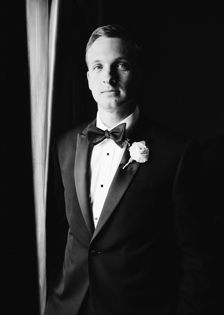 black and white groom portrait