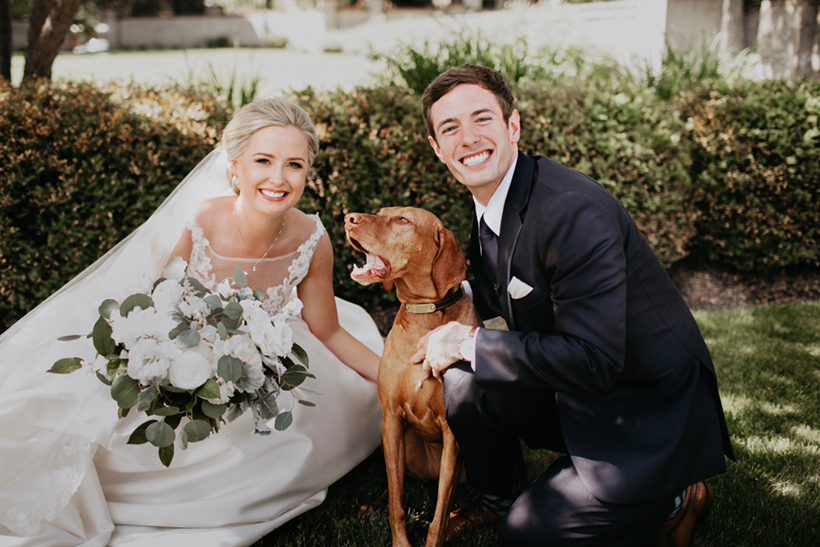 bride and groom picture with their dog