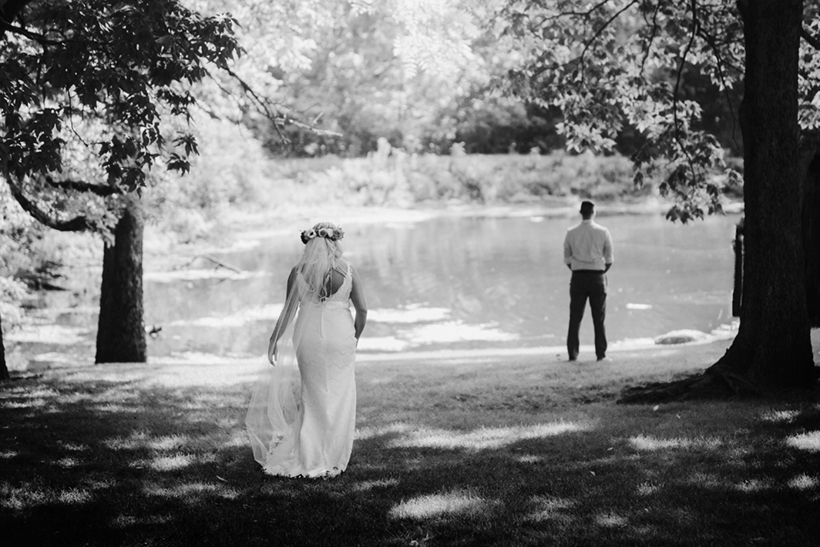 a first look between bride and groom at Ravina on the Lakes