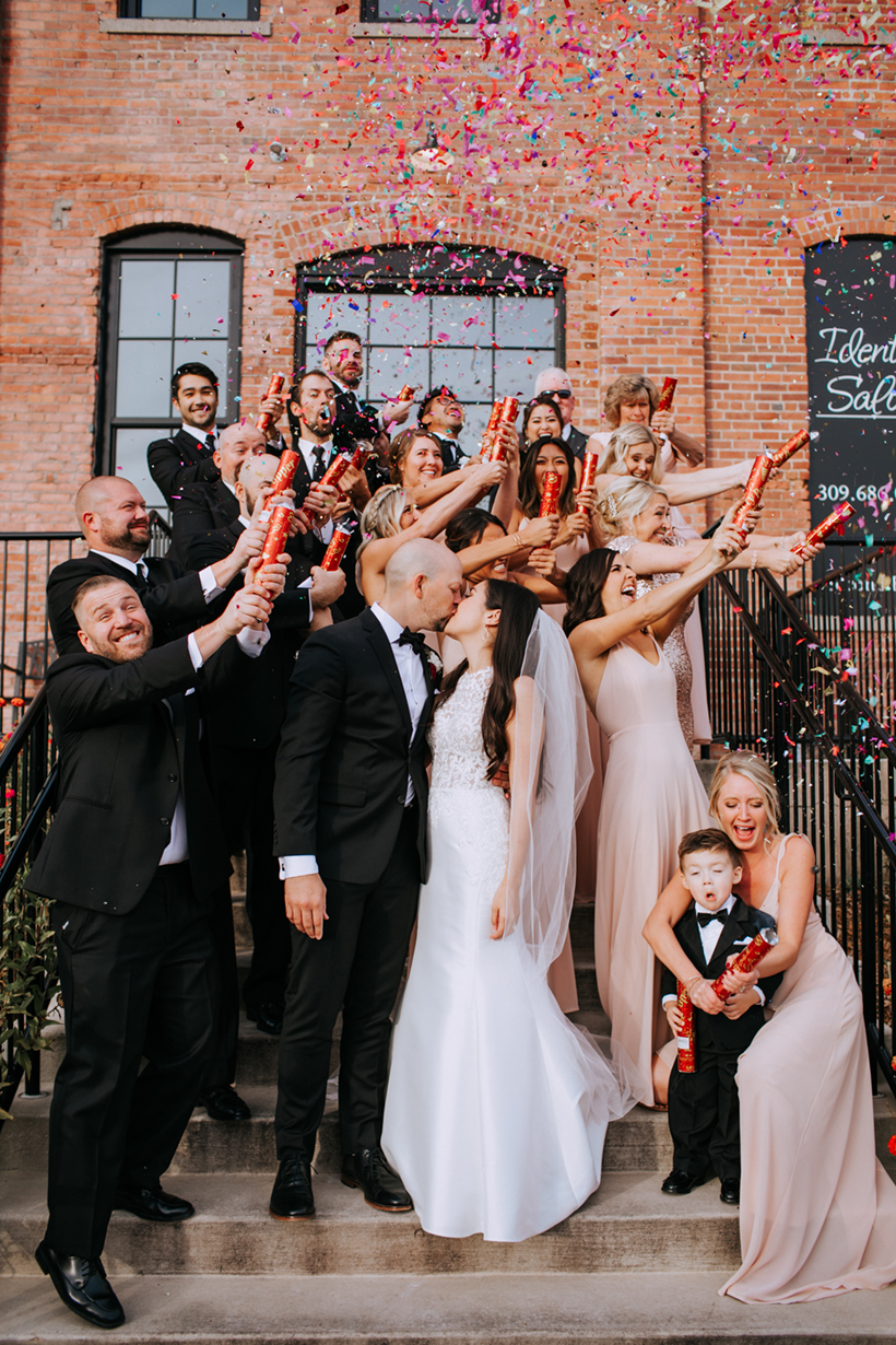 wedding party with confetti poppers