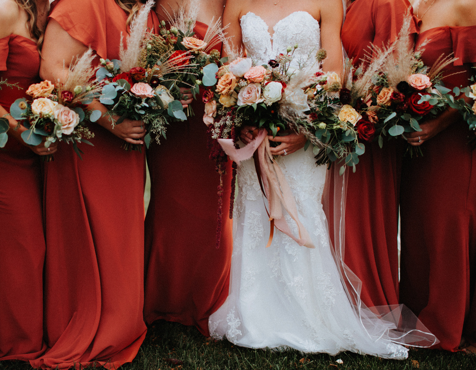 rust bridesmaids dresses with autumn bouquets