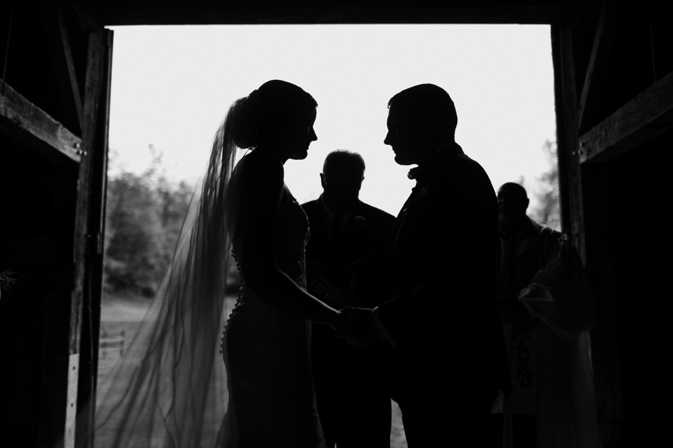 silhouette of bride and groom during wedding ceremony 