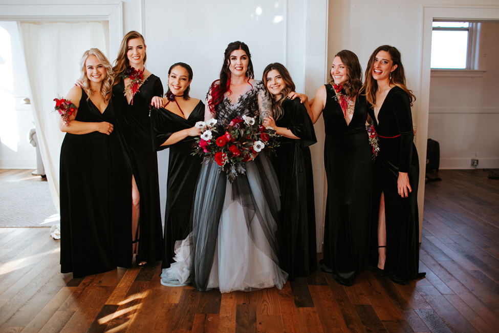 black wedding dress with bridesmaids