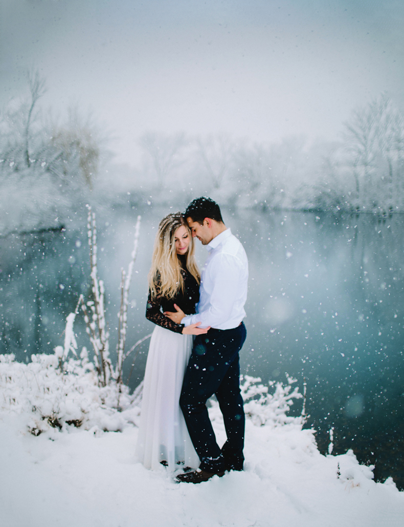 snowy engagement session by a lake in Peoria Illinois